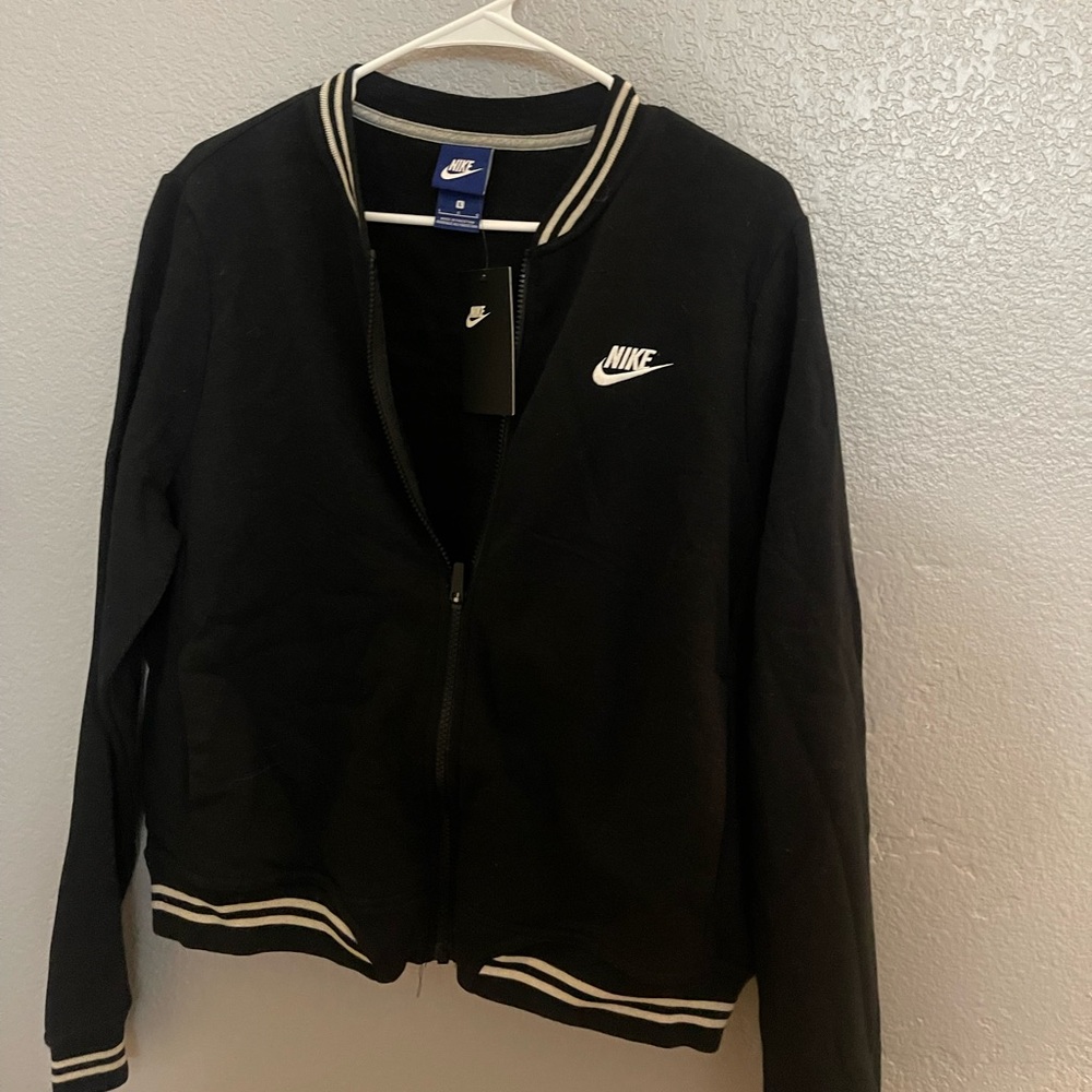 Women’s large Nike Varsity Jacket. NEVER worn!
